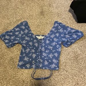 Blue shirt with white flowers